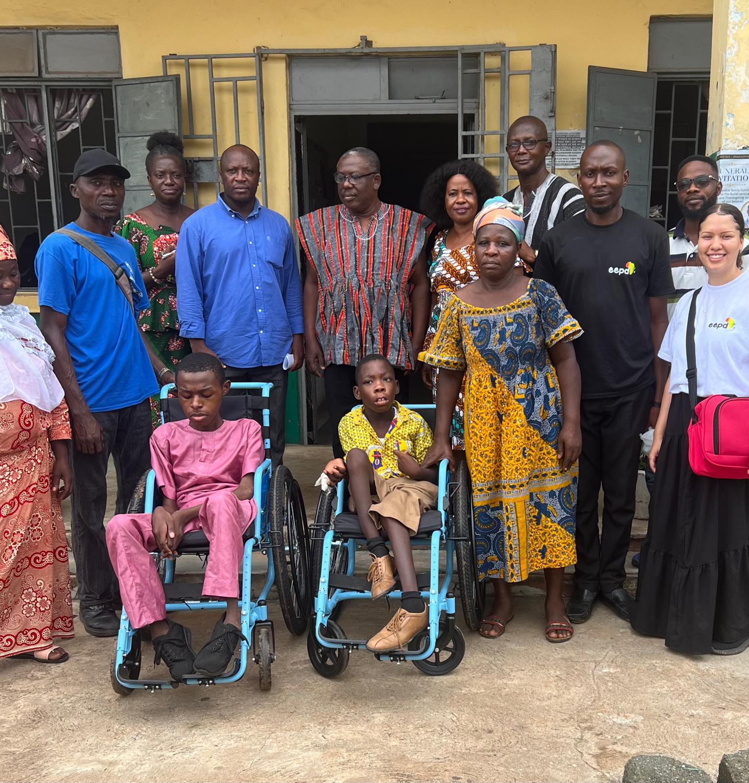 Family and volunteers posing together